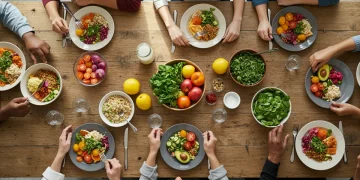People mindfully enjoying a sustainable, healthy meal together, focusing on fresh ingredients.